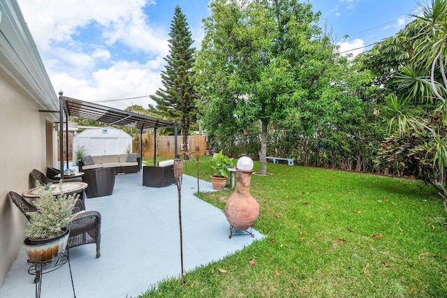 view of yard featuring a fenced backyard, an outdoor hangout area, a patio, and a pergola