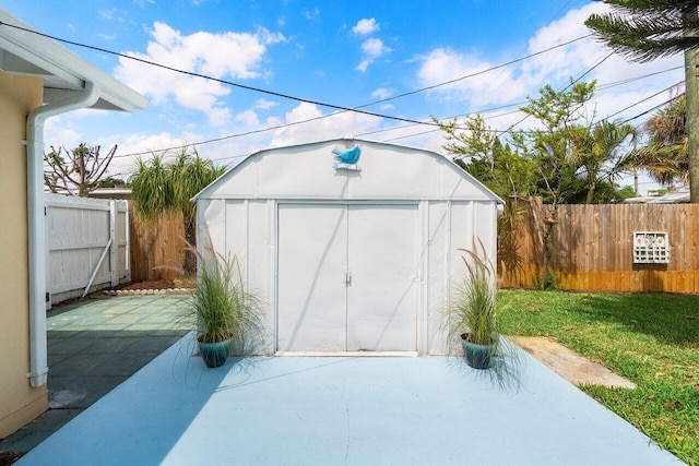 view of shed with a fenced backyard