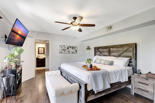 bedroom featuring visible vents, wood finished floors, and ceiling fan