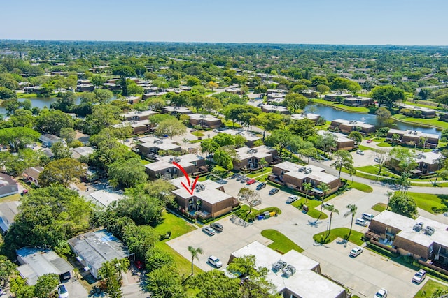 drone / aerial view featuring a water view and a residential view