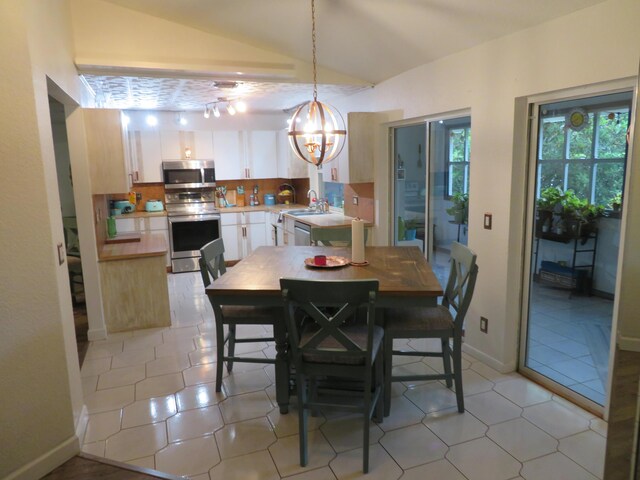 5372 Pine Cir, Coral Springs, FL 33067 - dining area featuring lofted ceiling and a chandelier