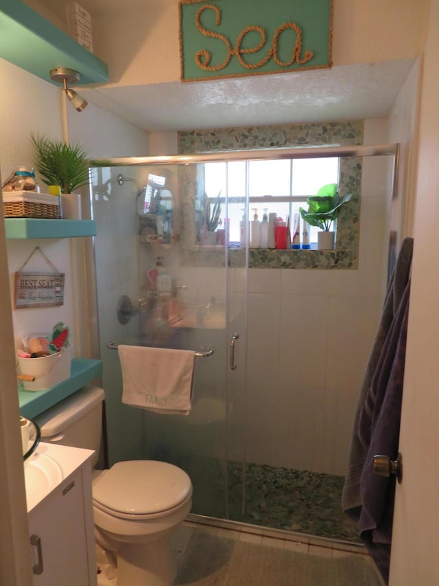 5372 Pine Cir, Coral Springs, FL 33067 - bathroom featuring vanity, a stall shower, toilet, and wood finished floors