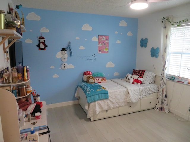 5372 Pine Cir, Coral Springs, FL 33067 - bedroom featuring multiple windows and wood finished floors