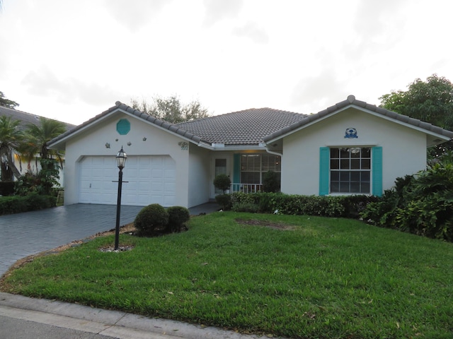 5372 Pine Cir, Coral Springs, FL 33067 - ranch-style home featuring an attached garage, driveway, a front lawn, stucco siding, and a tiled roof