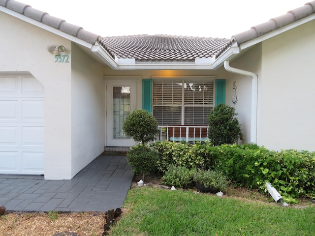 5372 Pine Cir, Coral Springs, FL 33067 - entrance to property with stucco siding and a tiled roof