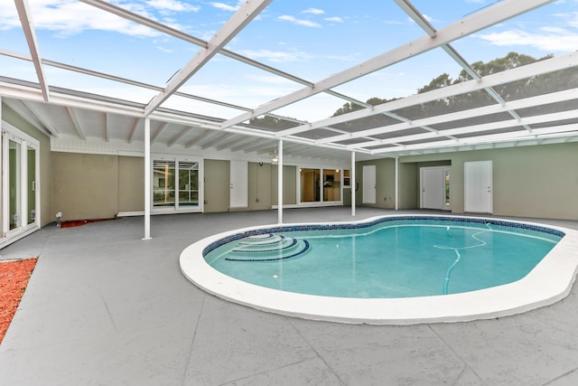 pool with a lanai and a patio