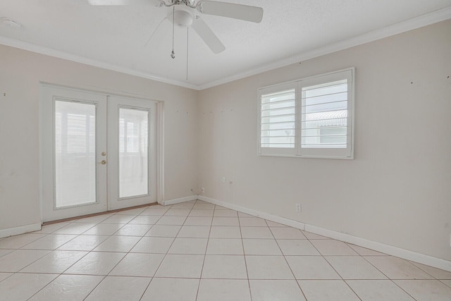 1304 SW 23rd St, Boynton Beach, FL 33426 - spare room with french doors, plenty of natural light, crown molding, baseboards, and light tile patterned flooring