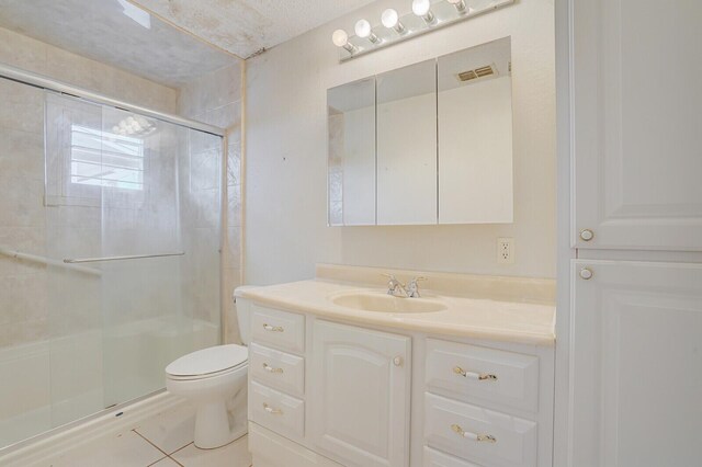 1304 SW 23rd St, Boynton Beach, FL 33426 - bathroom featuring vanity, a shower stall, toilet, and tile patterned flooring