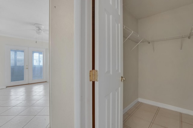 1304 SW 23rd St, Boynton Beach, FL 33426 - spacious closet with light tile patterned floors, french doors, and a ceiling fan