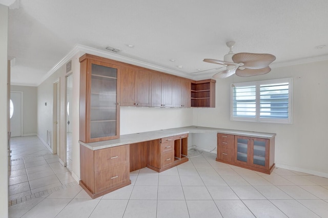 1304 SW 23rd St, Boynton Beach, FL 33426 - kitchen with crown molding, open shelves, brown cabinetry, a ceiling fan, and light tile patterned floors