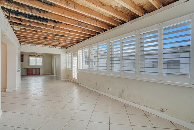 1304 SW 23rd St, Boynton Beach, FL 33426 - spare room featuring light tile patterned flooring, a ceiling fan, and baseboards