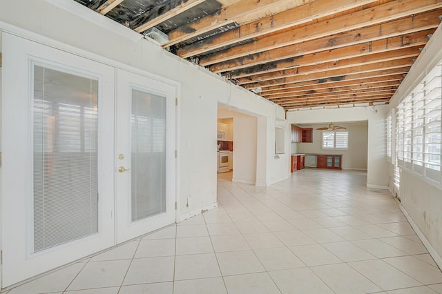 1304 SW 23rd St, Boynton Beach, FL 33426 - spare room featuring light tile patterned flooring and french doors