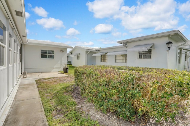 1304 SW 23rd St, Boynton Beach, FL 33426 - exterior space with stucco siding