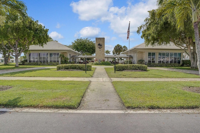 1304 SW 23rd St, Boynton Beach, FL 33426 - surrounding community with a lawn