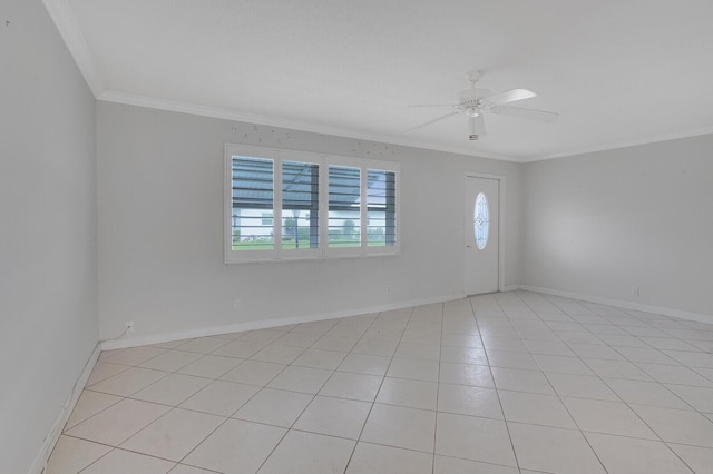 1304 SW 23rd St, Boynton Beach, FL 33426 - spare room with crown molding, a ceiling fan, light tile patterned flooring, and baseboards