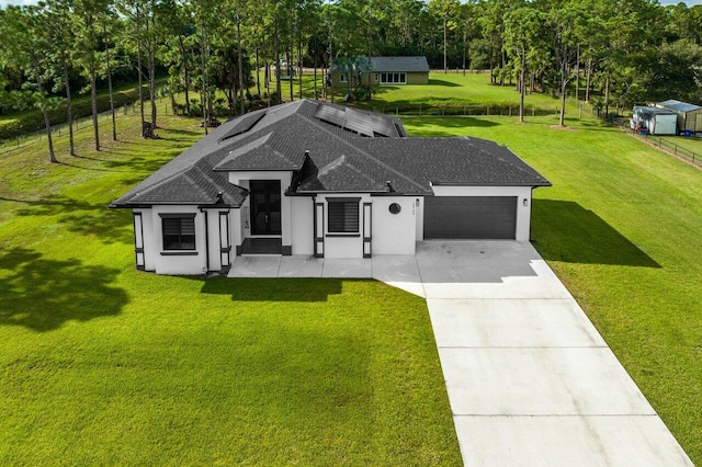 15744 68th Ct N, The Acreage, FL 33470 - view of front of home with stucco siding, roof with shingles, a front yard, an attached garage, and driveway