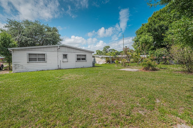 2008 Avenue Ave N, Fort Pierce, FL 34950 - back of house featuring a lawn