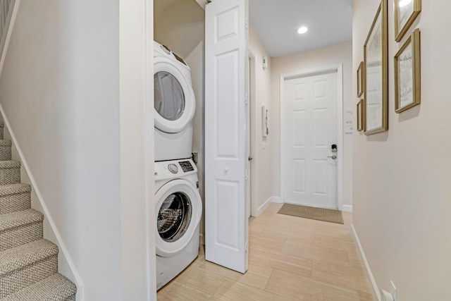 9339 World Cup Way, Port Saint Lucie, FL 34986 - laundry room featuring stacked washer / drying machine, baseboards, and recessed lighting