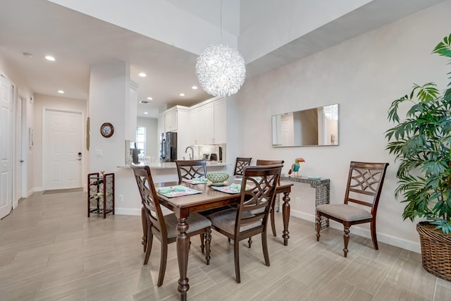 9339 World Cup Way, Port Saint Lucie, FL 34986 - dining room with a chandelier, baseboards, and recessed lighting