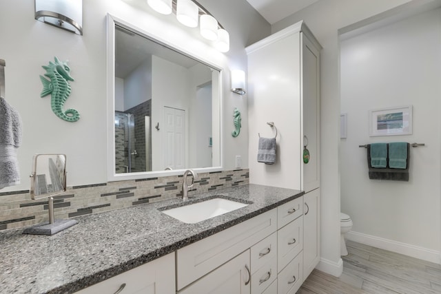 9339 World Cup Way, Port Saint Lucie, FL 34986 - bathroom with tasteful backsplash, a stall shower, toilet, and baseboards
