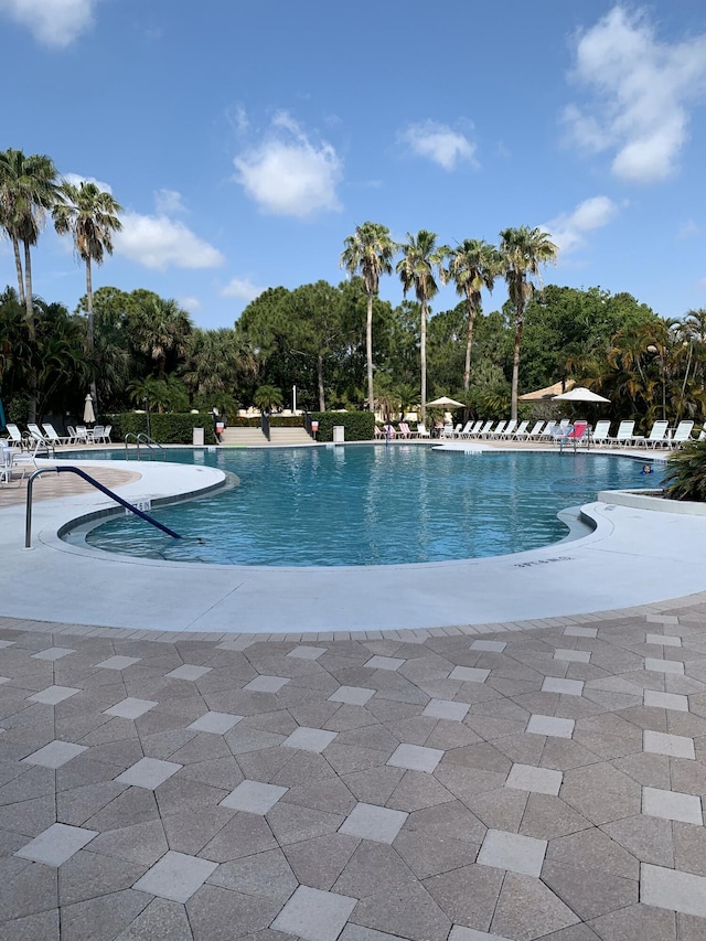 9339 World Cup Way, Port Saint Lucie, FL 34986 - community pool with view of scattered trees and a patio