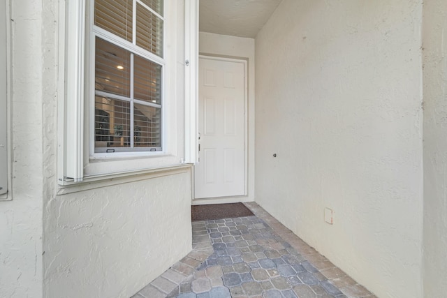 9339 World Cup Way, Port Saint Lucie, FL 34986 - doorway to property with stucco siding