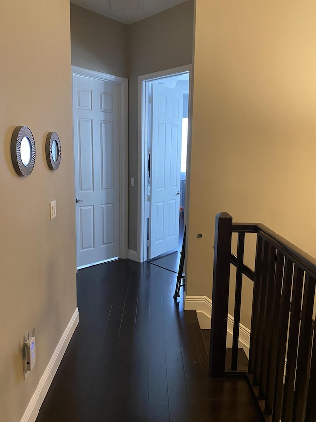 8481 NW 51st Ter, Doral, FL 33166 - hall featuring baseboards, an upstairs landing, and dark wood-style flooring