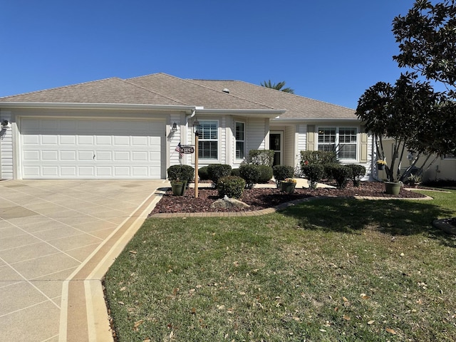 2479 Port Royal Ct, The Villages, FL 32162 - ranch-style house with a front yard, concrete driveway, a garage, and a shingled roof