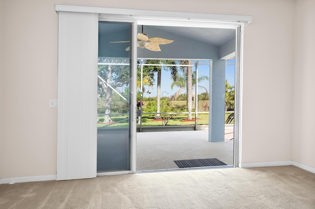 551 NW Red Pine Way, Jensen Beach, FL 34957 - doorway to outside featuring carpet, lofted ceiling, and a ceiling fan