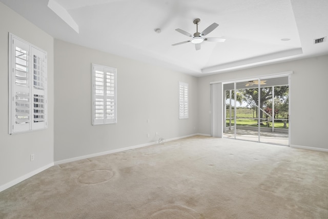 551 NW Red Pine Way, Jensen Beach, FL 34957 - carpeted spare room featuring a raised ceiling, a ceiling fan, and a smoke detector