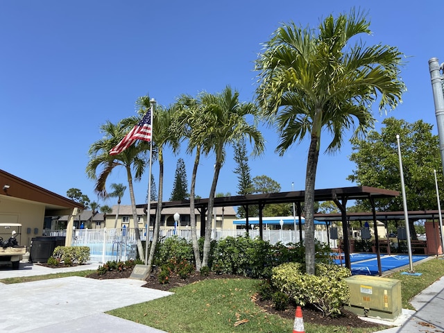334 Pine Ridge Cir Unit D-2, Greenacres, FL 33463 - community pool with fence and a patio area