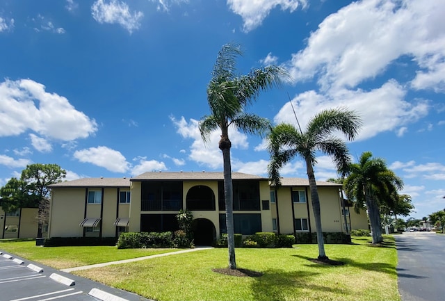 334 Pine Ridge Cir Unit D-2, Greenacres, FL 33463 - view of property featuring uncovered parking