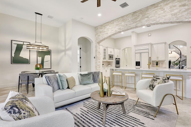 9387 Satinleaf Pl, Parkland, FL 33076 - living area with recessed lighting, arched walkways, light tile patterned floors, ceiling fan, and visible vents