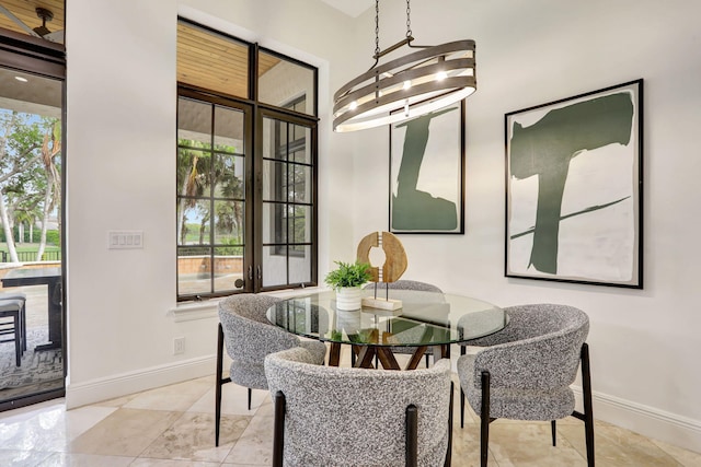 9387 Satinleaf Pl, Parkland, FL 33076 - dining area featuring baseboards