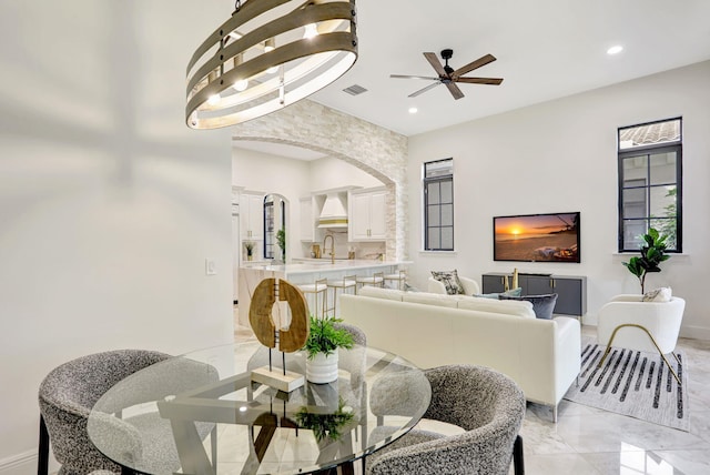 9387 Satinleaf Pl, Parkland, FL 33076 - dining area with recessed lighting, arched walkways, marble finish floor, visible vents, and a ceiling fan