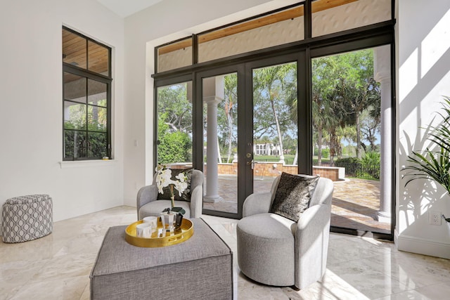 9387 Satinleaf Pl, Parkland, FL 33076 - living room with french doors, marble finish floor, and baseboards