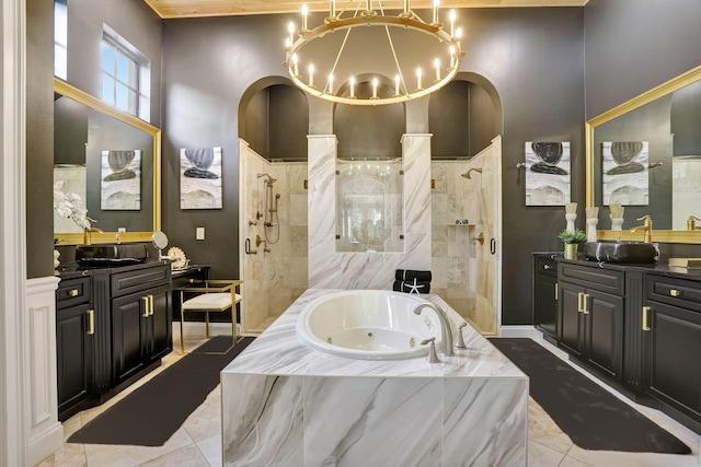 9387 Satinleaf Pl, Parkland, FL 33076 - bathroom featuring a tub with jets, two vanities, an inviting chandelier, and a walk in shower
