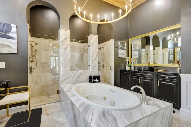 9387 Satinleaf Pl, Parkland, FL 33076 - full bathroom with marble finish floor, vanity, a shower stall, and a jetted tub