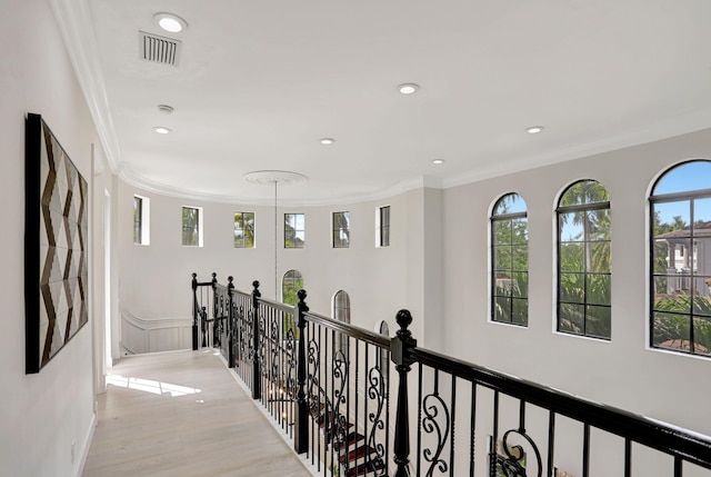 9387 Satinleaf Pl, Parkland, FL 33076 - hall featuring visible vents, an upstairs landing, crown molding, and recessed lighting