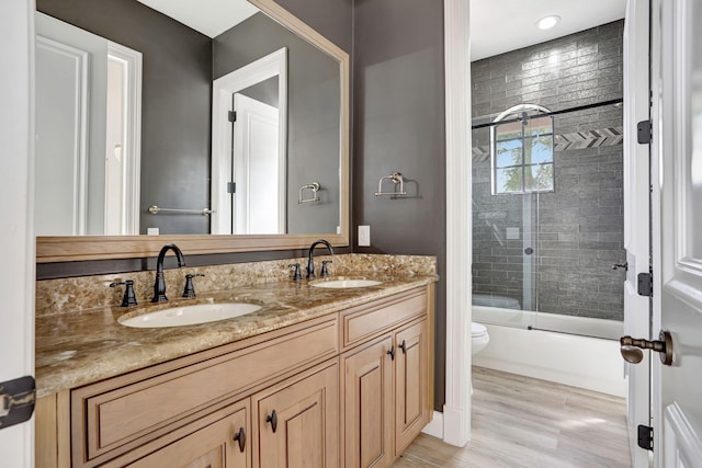 9387 Satinleaf Pl, Parkland, FL 33076 - full bath with enclosed tub / shower combo, toilet, double vanity, and a sink