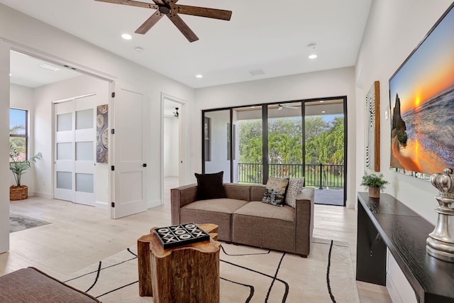 9387 Satinleaf Pl, Parkland, FL 33076 - living room featuring light wood-style floors, plenty of natural light, a ceiling fan, and recessed lighting