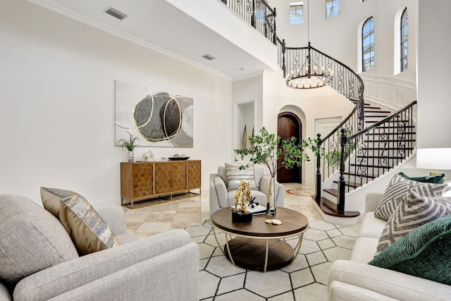 9387 Satinleaf Pl, Parkland, FL 33076 - living area with a high ceiling, visible vents, stairs, and crown molding
