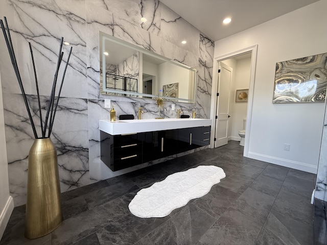 9387 Satinleaf Pl, Parkland, FL 33076 - bathroom featuring double vanity, baseboards, a marble finish shower, toilet, and marble finish floor