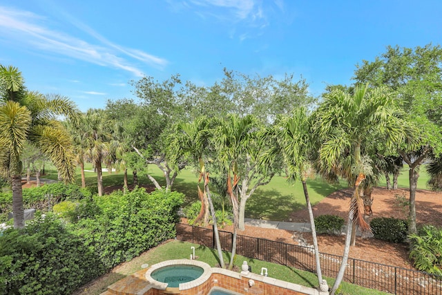 9387 Satinleaf Pl, Parkland, FL 33076 - view of swimming pool featuring an in ground hot tub and fence