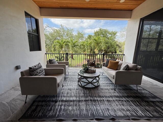 9387 Satinleaf Pl, Parkland, FL 33076 - balcony with an outdoor living space