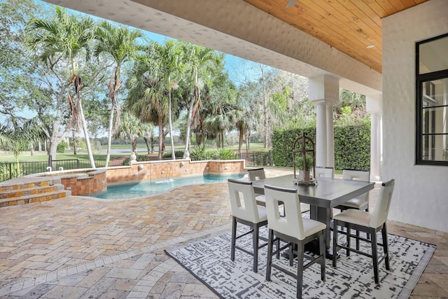 9387 Satinleaf Pl, Parkland, FL 33076 - view of patio / terrace with fence, an in ground hot tub, and an outdoor pool