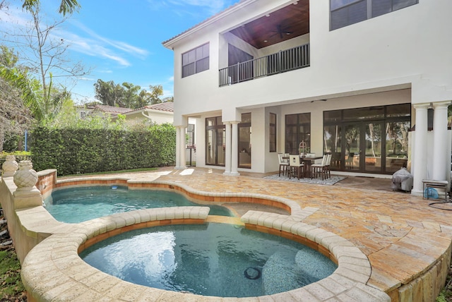 9387 Satinleaf Pl, Parkland, FL 33076 - view of swimming pool featuring a patio, a fenced in pool, a ceiling fan, outdoor dining space, and an in ground hot tub