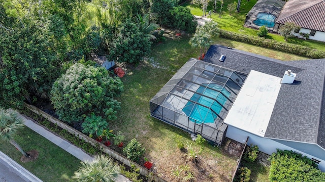 aerial view of property and surrounding area featuring a pool area