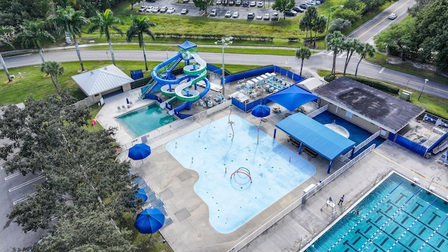view of swimming pool with a water play area and a water slide