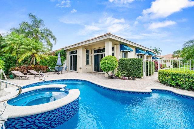 6346 San Michel Way, Delray Beach, FL 33484 - view of swimming pool with a patio and a pool with connected hot tub